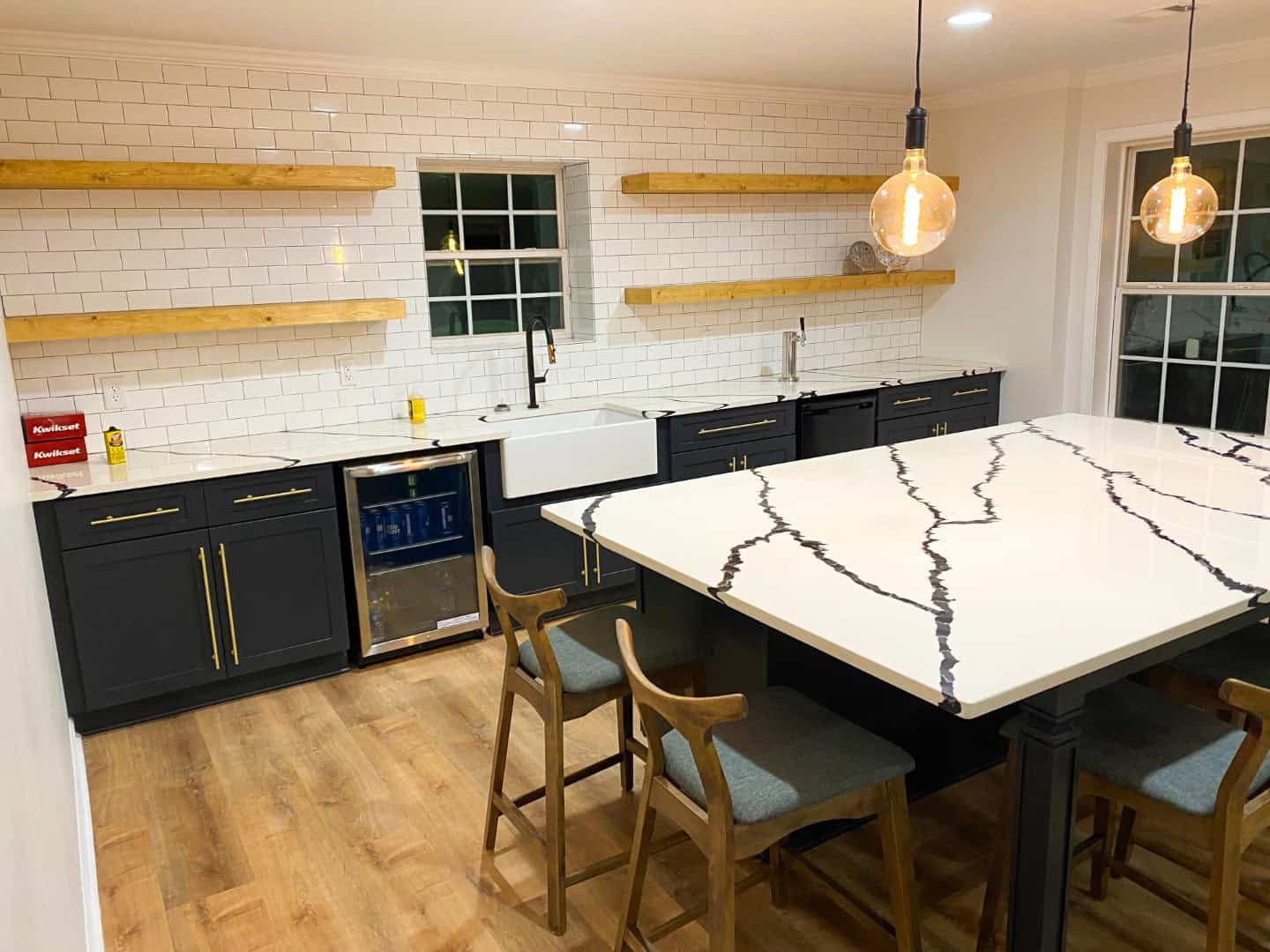 Transitional Kitchen With Contrasting Dark Cabinetry And Warm Wood Accents Kitchen Remodel in Atlanta, GA by All Weather Renovations project photo